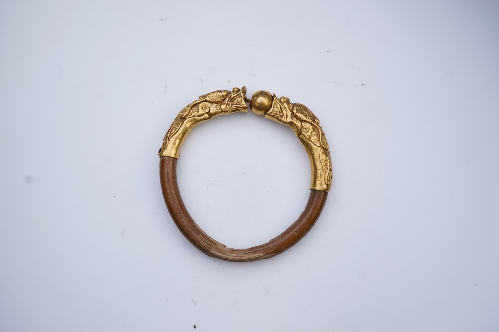 A gold and wood bangle, China, late 19th/early 20th century